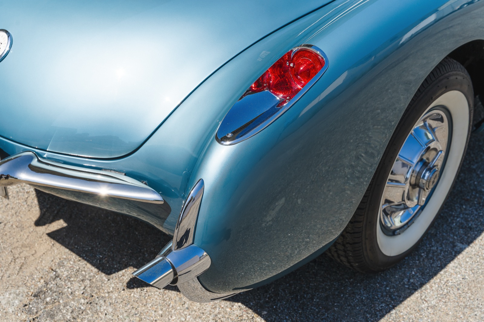 The matching rear tail light on the opposite side of the same car, framed from the same angle