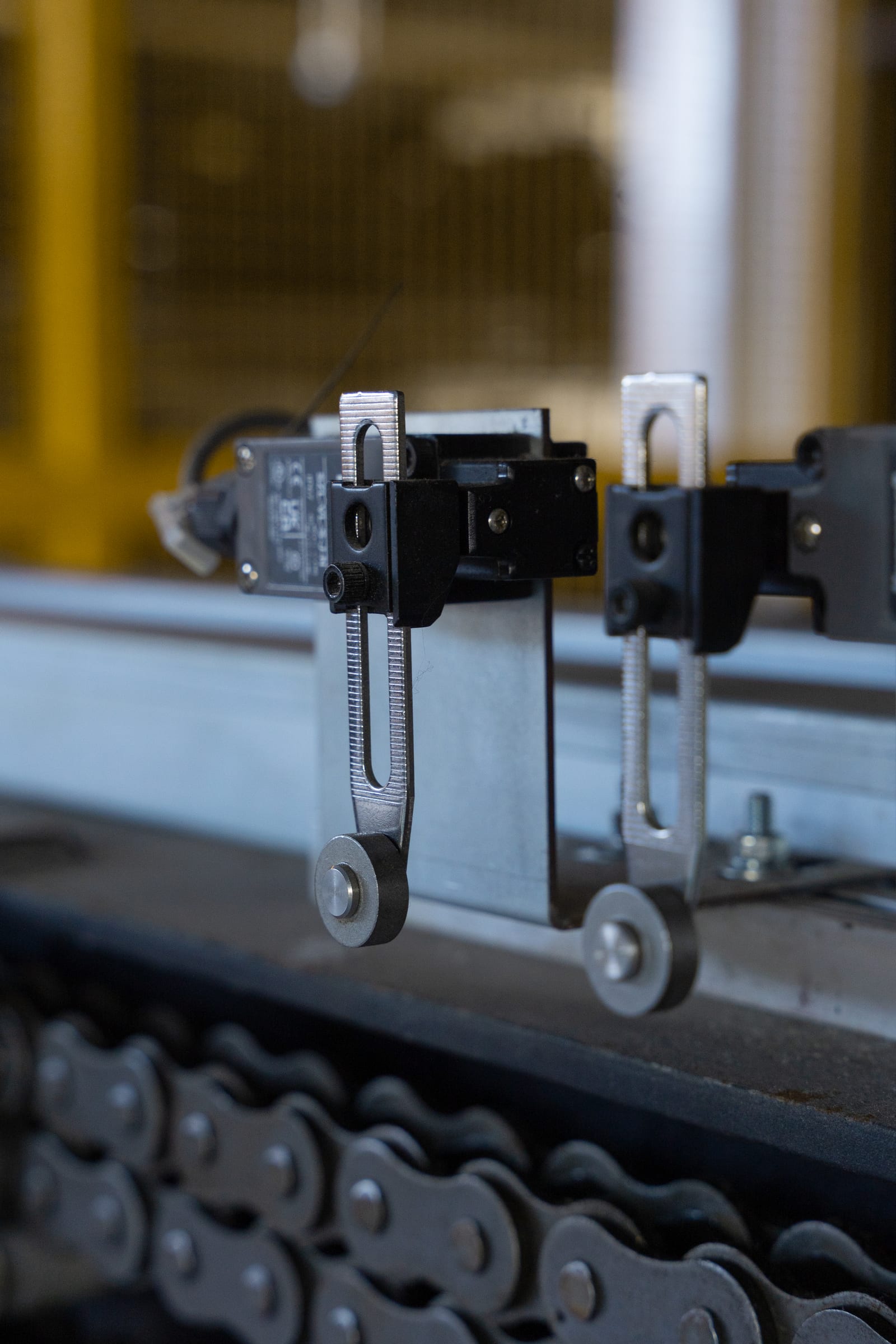 Parkworks automated parking system, Felix Apartments: close detail of the lift chain and guide hardware