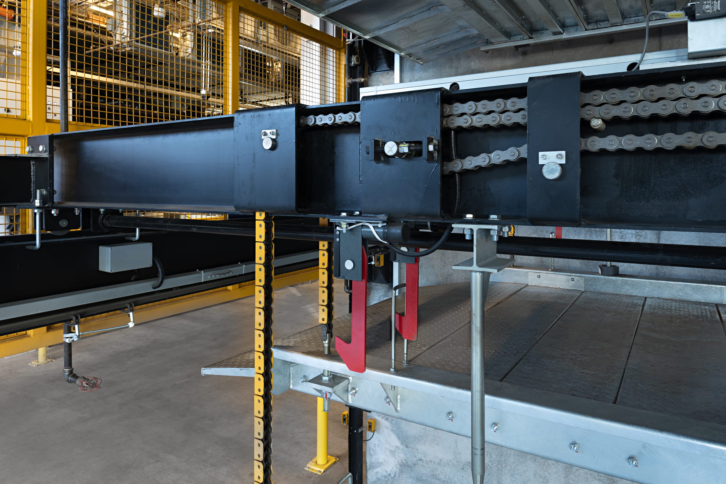 Parkworks automated parking system, Felix Apartments: the lift beam, drive chain and locking hardware in detail